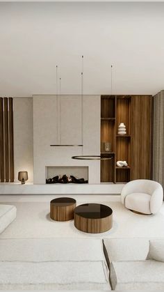 a modern living room with white furniture and wood paneling on the walls, along with a fireplace