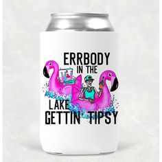 a white can cooler with pink flamingos and the words, everybody in the lake gettin't tipsy