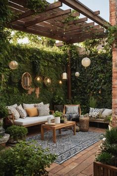 an outdoor living area with couches, tables and potted plants