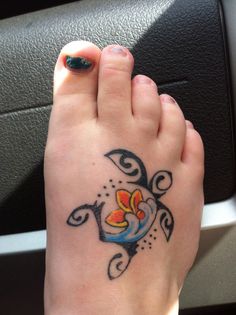 a person with a tattoo on their foot