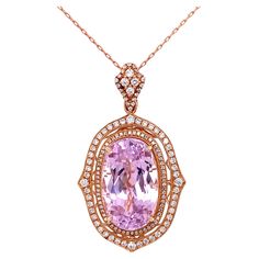 Exquisite Kunzite and Diamond Drop Necklace, centering a securely set Oval Kunzite, weighing approx. 21.20 Carat surrounded by Diamonds, approx. 0.92tcw. Suspended from a 14K, 18” long chain. Beautifully Hand crafted in 14K Rose Gold setting. In excellent condition, recently professionally cleaned and polished. Chic and Classic…A sure to be admired perfect complement to every wardrobe…illuminating your look with Timeless Beauty! Luxury Diamond Necklace With Accent Stones, Elegant Gia Certified Pendant Necklace, Luxury Diamond Necklaces With Accent Stones, Luxury Pendant Necklaces With Accent Stones, Luxury Round Necklaces With Accent Stones, Diamond Drop Necklace, Rose Gold Pendant Necklace, Rose Gold Pendant, Royal Jewelry