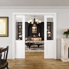 a living room filled with furniture and a fire place next to a dining room table