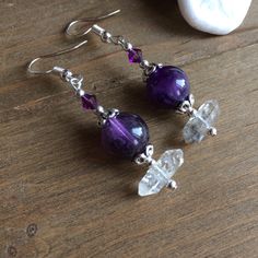 Amethyst earrings boho natural stone earrings purple handmade quartz crystal earrings dangle tribal earrings unique jewelry for women SLD These beauties have 12mm double terminated quartz crystal rhutilated drop beads, 10mm amethyst beads, 4mm Swarovski crystal beads, silver plated findings and ear wires. Unique boho earrings from SLDbeadwork. Earrings for women. Yes, please. I love to rock a great pair of earrings. Stone, crystal, lampwork, beaded earrings, well I love all of them Can't find yo Amethyst Wire Wrapped Crystal Earrings As Gift, Handmade Amethyst Drop Earrings, Bohemian Amethyst Crystal Earrings For Gift, Bohemian Amethyst Crystal Earrings As Gift, Bohemian Purple Dangle Crystal Earrings, Silver Amethyst Wire Wrapped Earrings, Amethyst Crystal Earrings For Jewelry Making, Bohemian Crystal Gemstone Earrings For Gift, Amethyst Gemstone Crystal Earrings For Jewelry Making