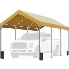 a white truck parked under a yellow awning on top of a white truck bed