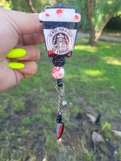 "Super Cute Meyers coffee badge reel Approximately 2\" tall. Beads may vary. Check out the cute matching pen under pens.  Badge reels are attached with 3M dual lock velcro and are interchangeable. If you prefer a permanent glue please send me a note when you purchase. CAUTION: All items have small parts. Please do not leave children unattended. These small parts could cause a choking hazard. Care instructions: Please avoid dropping, while items are durable, they are not indestructible. Please handle with care. Different colors available. Send me a message for customs. RETURNS/EXCHANGES: Due to all items being personalized and made to order we do not accept returns or exchanges. If there are any issues with your order you must notify us within 24 hours of delivery. Thank you! CHANGE OF ADDR Themed Black Badge Reel For Gifts, Themed Black Badge Reel For Gift, Themed Black Badge Reel As A Gift, Themed Black Badge Reel Gift, Themed Black Badge Holders For Gift, Novelty Black Badge Reel For Gift, Fun Black Badge Reel For Gifts, Cute Horror, Horror Gifts