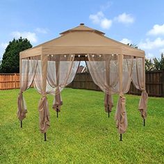 an outdoor gazebo with mosquito netting and lights on the top, in a yard