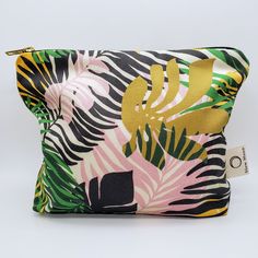 Cosmetic bag / Wash bag - Organic cotton - Tropics This product is designed by me. Priscilla, a London based printed textile designer. The fabric is printed in the UK by an independent printers.  Fully lined with organic cotton and is washable. The gold metal zip gives this bold and brightly coloured cosmetic bag the perfect finishing touch! Size: 18cm x 24cm x 6cm Green Rectangular Cosmetic Bag For On-the-go, Green Rectangular Pouch For On-the-go, Green Rectangular Cosmetic Bag For Travel, Eco-friendly Rectangular Cosmetic Bag For Daily Use, Green Travel Bag With Zipper Pouch, Tropical Multicolor Bags For Daily Use, Eco-friendly Green Pouch Bag, Multicolor Zipper Pouch Bag For Gift, Green Pouch Bag With Zipper