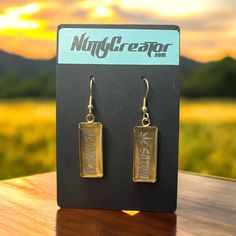 Elevate your style with our Laser Engraved Stainless Steel Dangle Earrings! Featuring "Sativa" on one earring and "Indica" on the other, these sleek and modern accessories are perfect for enthusiasts. Crafted from high-quality stainless steel, gold in color, they are durable, hypoallergenic, and lightweight. The minimalist design ensures they complement any outfit, making a bold statement without saying a word. Show off your unique taste and passion with these chic, engraved earrings. Engraved Metal Earrings As Gift, Engraved Metal Earrings For Gift, Gold Etched Earrings As Gift, Gold Etched Earrings For Gift, Gold Etched Dangle Jewelry, Gift Gold Etched Earrings, Engraved Earrings, Engraved Stainless Steel, Modern Accessories