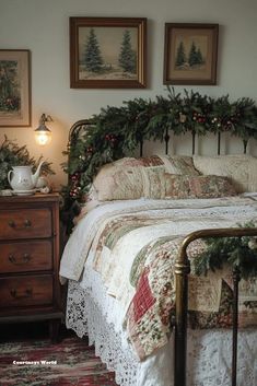 there is a bed with christmas decorations on the headboard and night stands next to it