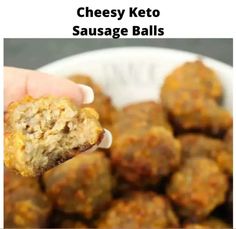 a hand holding a piece of cheese keto sausage balls