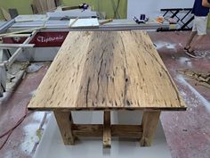 a wooden table being built in a workshop