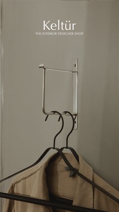 a coat hanger with clothes hanging on it