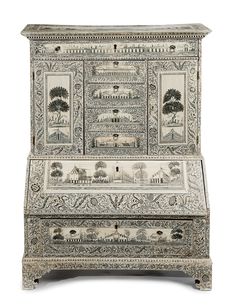 an ornately decorated chest with two drawers