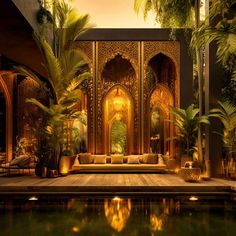 an elaborately decorated room with water in the foreground and palm trees on either side