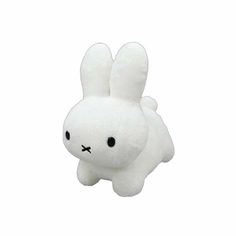 a white stuffed animal with black eyes on it's face and ears, sitting in front of a white background