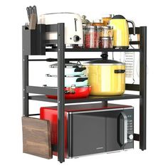 a kitchen shelf with pots, pans and other cooking items on top of it