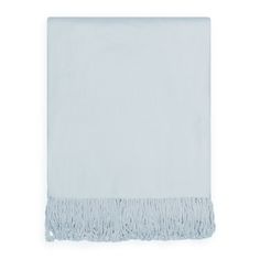 a white towel with fringes on it