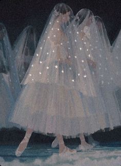 a group of women in white dresses and veils with stars on their heads walking down a runway