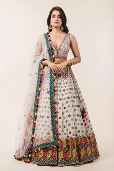 Ivory lehenga with attached cancan, highlighted with applique floral embroidery, sequin embellishments and drawstring at the side with pompoms. Comes with plunging neckline padded blouse and tulle pink dupatta.
Component: 3
Embroidered
Neckline: V-Neck
Sleeve Length: Sleeveless
Fabric: Lehenga and Blouse: Georgette; Dupatta: Tulle
Color: White
Applique, resham and patra embroidery
Embroidered blouse with tie-up at the back
Cutout at the back
Embroidered dupatta with pompoms at the hem
Closure:
B Lehenga And Blouse, White Lehenga, Georgette Lehenga, Indian Outfits Lehenga, Designer Outfit, Applique Work, Georgette Dupatta, Royalty Aesthetic, Embroidered Lehenga