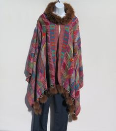 Unique One-Of-A-Kind Himalayan Yak/Sheep Wool Blend & Fox Fur Cape/Shawl/Wrap !!!…Ideal Unique Handcrafted gift for you, family, your friends and co-workers…!!! Handloomed/Handcrafted by Artisans Hand Embroidery Stitched Accents that Emphasize the Patterns in the Shawl Design,  Boiled Himalayan Yak/Sheep Wool Blend Shawl Handmade in Nepal Fox Fur Collar Fox Fur Tassels or Fringe at Both Ends Tribal Design and Pattern A Yak & Sheep Wool Blend of yarns hand loomed shawl in Nepal is handcrafted by Multicolor Alpaca Shawl For Winter, Bohemian Alpaca Shawl For Winter, Bohemian Alpaca Shawl One Size, Hippie Winter Shawl, Traditional Woven Winter Shawl, Handmade Folk Shawl For Winter, Bohemian Woven Winter Shawl, Artisan Multicolor Poncho One Size, Handmade Multicolor Winter Poncho