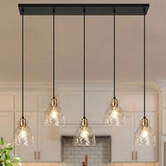 an image of a kitchen with lights hanging from the ceiling