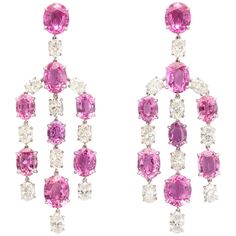 Elegant, and opulent, these wonderful chandelier earclips feature 16 vibrant, pink sapphires (37.20cts total weight) expertly set with the whitest of white diamonds. The seventeen oval diamonds weigh a total of 7.61cts with three of them weighing exactly 1/2 carat each, certified by the GIA E VVS2, E VS1 and D VVS2. The finest clip backs insure comfort for the wearer, while the delicate mounting makes the stones appear to float gracefully beneath the ears. Pink Sapphire Jewelry, Diamond Chandelier Earrings, Diamond Chandelier, Titanic Jewelry, Platinum Diamond Rings, Expensive Jewelry, Vintage Chandelier, Antique Earrings, Sapphire Jewelry