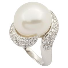 South Sea Pearl with Diamond 0.69 carat Ring set in 18 Karat White Gold Settings Width: 1.7 cm Length: 1.8 cm Ring Size: 50 Total Weight: 9.8 grams South Sea Pearl: 13.2 mm "We first opened doors in 1980 when it was then situated in the vicinity of the Victory Monument; a small and modest storefront with a couple of counters. From its humble beginnings to where it stands today, our company has proven its abilities as a jeweler. Since the beginning, we have been supplying fine quality pieces to d Luxury White Gold Pearl Ring With Halo Setting, Pearl Diamond Ring, Glittery Wallpaper, Pearl Jewelry Design, Pearl And Diamond Ring, Diamond Cocktail Rings, Diamond Ring Settings, Sea Pearl, Jewellery Ideas