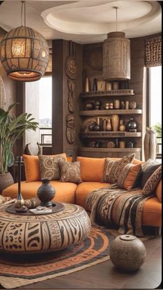 a living room filled with lots of furniture next to a large potted palm tree