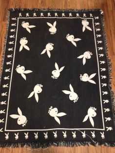 a black and white rug with bugs on it