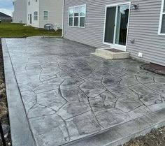 a concrete patio in front of a house