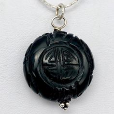 EXOTIC Carved Long Life Obsidian Bead Pendant! This pendant of Black Obsidian will give you a great contrast for your jewelry! It has been intricately hand carved with the Chinese Long Life character. The detailing on these pendant is exquisite! It is the same front and back. Don't miss out on this once in a lifetime find! NOTE: Images do not reflect number and size. Please see detail and table for information. Quantity: 1 pendantMaterial Type: Obsidian Size: 25x10mm Color: Black Legend: This sy Carved Amulet Pendant Jewelry, Obsidian Pendant Amulet Necklace, Spiritual Carved Round Pendant Necklaces, Spiritual Carved Round Pendant Necklace, Obsidian Amulet Pendant Necklace, Carved Amulet Pendant Necklace, Carved Pendant Amulet Necklace, Carved Round Pendant Amulet Necklace, Carved Pendant Necklace Amulet Style