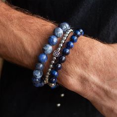 Embark on a journey of luck with our Nassau bracelet stack! The sophisticated Nassau stack features a trifecta of beaded delights - Blue Tiger Eye, Silver Glitz, and Dumortierite - creating an alluring trifecta of good fortune and charm. Indulging the adventurous spirit and wandering heart that lives within all of us, our men's bracelet stacks have been crafted to provide a touch of class to your wardrobe throughout the year. Each exquistely curated stack includes a mix of spiritually healing ge Mens Bracelet Beads, Men's Beaded Bracelets Handmade, Luxury Beaded Bracelets With Natural Stones, Luxury Blue Round Bead Bracelets, Luxury Stackable Beaded Bangle Bracelets, Elegant Blue Stackable Beaded Bracelets, Luxury Blue Bracelets With Natural Stones, Luxury Blue Bracelet With Natural Stones, Luxury Blue Beaded Bracelets