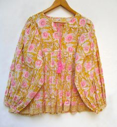 "ITEM DESCRIPTION yellow pink blossom floral printed cotton blouse and tops - Henley neckline with tassel blouse - long sleeve with buttons blouse - with lace Features : Long sleeve, Henley neck, Blouse Material : Cotton cambric Fabric: 100% cotton soft light weight ethnic print fabrics Sleeve Length = 22 inch For more sizes & their measurement, please refer our below chart to understand the sizes variations available with us For your size requirement, please mention your size in seller note at Colorful Blouses For Women, Pulse Size Summer Outfits, Fun Blouses, Long Sleeve With Buttons, Tassel Blouse, Spring Blouses, Summer Blouse, Blouse Long Sleeve, Lace Tunic