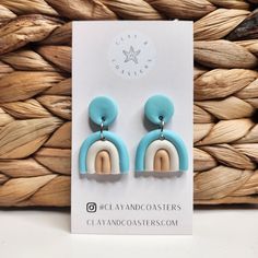 Introducing the Teal and Ivory Neutral Rainbows Earrings, a stunning piece of handcrafted jewelry that captures the beauty of nature and the joy of a rainbow. These earrings feature teal clay and nude-colored polymer clay and paired with a white ivory polymer clay for a neutral look. Each earring is completely unique and one of a kind. The earrings are finished with surgical steel. A hypoallergenic hardware, making them safe for even the most ears.  Whether you're heading to the beach or simply want to add a touch of whimsy to your everyday look, the Yeal and Ivory Neutral Rainbows Earrings are the perfect accessory. Don't miss out on the opportunity to own a truly special and beautiful piece of jewelry. Order yours today! Blue Clay Dangle Jewelry, Artsy Polymer Clay Dangle Jewelry, Everyday Blue Clay Jewelry, Artsy White Everyday Jewelry, Rainbow Polymer Clay Jewelry For Gifts, Multicolor Clay Jewelry With Matching Earrings, Multicolor Clay Dangle Jewelry, Handmade Rainbow Resin Jewelry, Bohemian Dangle Clay Jewelry