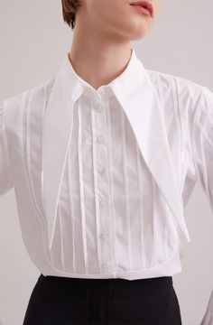 The ALFRED is a modern shirt with a contemporary fit, made from lightweight poplin. The point collar is extended and long, with a French cuff that allows for cufflinks. Pintucks on the shoulders and front bib create a feminine touch. Princess darts on the back provide a flattering shape. Wear this as part of your work wardrobe or as everyday casual wear. Style Nr. H22F082 Princess darts on the back for shape Body: 97% Cotton, 3% Elastane Poplin is a type of plain weave that consists of long cott Anne Fontaine White Shirt, Pintuck Shirt, French Cuff, Shape Wear, Work Wardrobe, Woman Fashion, Poplin Shirt, White Shirts, Pin Tucks