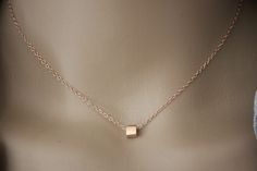 "Minimalist choker necklace, silver sterling pink gold plated with cube pendant - fine pink gold necklace - silver choker - silver cube necklace My rose gold jewelry is made with solid silver findings with 18k rose gold plating.  Necklace in pink gold silver minimalist style. Silver sterling chain with 4cm extension chain. Several lengths available. 1 silver pink gold cube bead 5mm is mounted on the chain. Do not hesitate to contact me if you want another length. ♦ All my jewelry is made to order according to the dimensions you have chosen. Please check your measurements carefully. ♦ My jewelry is also delivered \"ready to offer\" and packaged in a pretty gift bag. Sending neat. For further information, please feel free to contact me via the tab \"contact the creator\" (answer within 24 ho Modern Rose Gold Necklaces As Gift, Modern Rose Gold Necklaces For Gifts, Modern Rose Gold Necklace As Gift, Modern Rose Gold Necklace For Gifts, Modern Rose Gold Necklace Gift, Minimalist Jewelry With Delicate Chain And Square Pendant, Minimalist Jewelry With Delicate Square Pendant, Minimalist Pink Gold Necklace For Gift, Rose Gold Square Pendant Jewelry In Sterling Silver