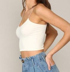 We love wearing this brami under loungewear, sweatshirts, hoodies , tees & pj's. The seamless detailing and elastic spaghetti straps makes this white brami so cozy with just the right amount of stretch. Also available in black and dusty lilac! white seamless elastic spaghetti brami with ribbed bottom unpadded Trendy White Seamless Crop Top, White Stretch Cami Crop Top, Casual Bra-friendly Cropped Camisole, Casual Cropped Bra-friendly Camisole, Cropped Tank Top With Built-in Bra For Loungewear, Bra Friendly Crop Top Tank For Loungewear, Trendy Bra Friendly Spaghetti Strap Tops, Trendy Tank Straps Crop Top For Loungewear, Trendy Loungewear Spaghetti Strap Tops