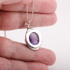 This "Murazaki" pendant necklace is handmade of 999 fine silver. It has been hand crafted in pure 99.9% solid silver in my workshop. It features a translucent Amethyst gemstone. "Murazaki" means "purple" in japanese. NOTE: This piece of jewelry has been created around this one-of-kind gemstone. It is unique and cannot be reproduced. Only one available! Sterling Silver Gemstone Necklace For Meditation, Purple Sterling Silver Necklace With Polished Finish, Hallmarked Amethyst Round Pendant Necklace, Purple Necklace With Polished Finish As Gift, Hallmarked Amethyst Pendant Necklace, Silver Amethyst Necklace For Meditation, Artisan Sterling Silver Necklace With Birthstone, Amethyst Oval Pendant Necklace For Gift, Sterling Silver Teardrop Amulet Necklaces