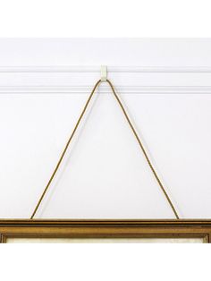 a wooden frame hanging on the wall