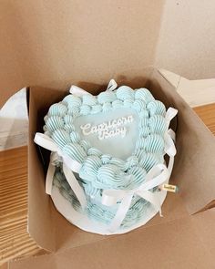 a cake in a box with the words happy birthday written on it