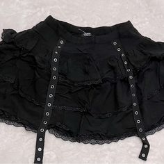 Black Skirt From Hot Topic, Mid Length Lace Frills Black Punk Skort For Summer, Black Punk Style Skort For Summer, Black Punk Mini Skirt For Festival, Punk Style Black Mini Skirt For Festival, Black Rock Mini Skirt For Festival, Rock Style Black Mini Skirt For Festival, Black Rock Style Mini Skirt For Festival, Edgy Black Mini Skirt With Ruffles, Gothic Black Bottoms For Spring