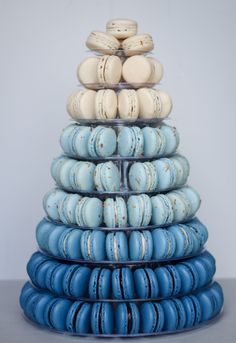 a stack of blue and white macaroons sitting on top of each other