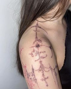 a woman with a tattoo on her arm