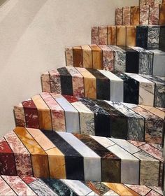 the stairs are made out of marble tiles and have different designs on them, as well as colors