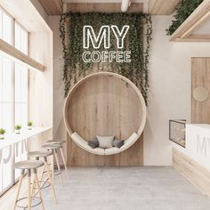 the interior of a coffee shop with plants growing on the wall and round wooden chair