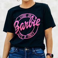 Brand New Women’s Barbie Shirt “Come On Barbie Lets Go Party” Size: Small Pit To Pit: 20” Color: Black & Pink Fun Black Party Tops, Pink Letter Print Top For Party, Pink Casual T-shirt For Party, Casual Pink T-shirt For Party, Black Fun T-shirt For Casual Party, Casual Pink Party T-shirt, Fun Black T-shirt For Party, Pink Letter Print Party Top, Fun Black Party T-shirt