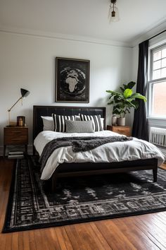 a bedroom with hardwood floors and a bed in the middle, along with a rug on the floor