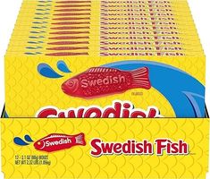 swedish candy candies are stacked on top of each other in a display box for sale