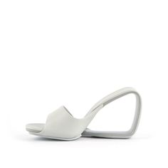 Modern Sandals With Sculpted Open Heel, Modern Slides With Padded Heel, Modern Slip-on Slides With Padded Heel, Modern Sandals With Heel Loop And Open Heel, Modern Formal Slides With Open Heel, Modern Sandals With Wrapped Heel And Single Toe Strap, Modern Slip-on Mules With Heel Loop, Modern Slip-on Slides With Heel Loop, Modern Formal Slides With Sculpted Heel