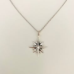 Description: The North Star is what gives guidance and sense of familiarity for any globetrotter. 3 layers of stars on top of each other makes up a 16 point star. Let this celestial beauty adorn your neck.  Match it with our silver moon and star ring.  Made out of 925 sterling silver.  Diameter : 25x 25 mm  Comes gift wrapped  My jewellery is packaged in a sturdy gift box that protects it and makes it easily to store.   Online store : www.raw-london.co.uk Instagram: @rawlondonjewellery Email me: sales@raw-london.co.uk  Do not hesitate to contact me with any doubts, I am happy to help you! Metal: Stone  Condition: New Collection: Etsy Collection Designer: Lina Mellberg Six Point Star Necklace, Star-shaped Compass Necklace As Gift, Star-shaped Compass Necklace As A Gift, Star-shaped Compass Necklace Gift, Star-shaped Compass Design Necklace As Gift, Star-shaped Compass Design Necklace For Gift, Spiritual Silver Charm Necklace With Star, Sterling Silver Star-shaped Jewelry With Compass Design, Silver Celestial Charm Necklace With Star Charm